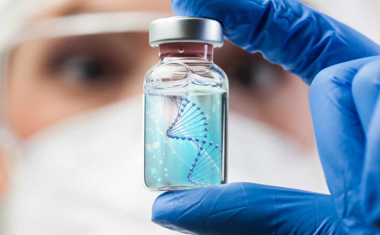 UK lab scientist biotechnologist holding glass
